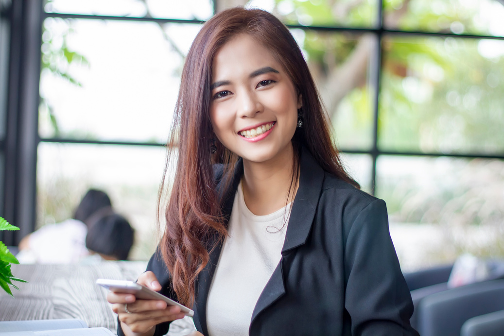 Asian Business Women holding Smartphone